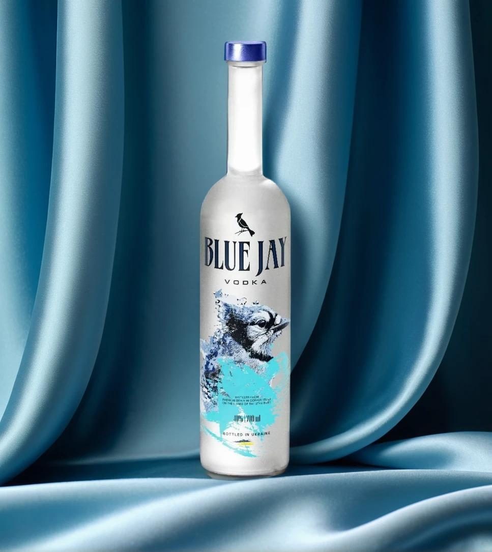 Blue Jay Vodka bottle on blue silk